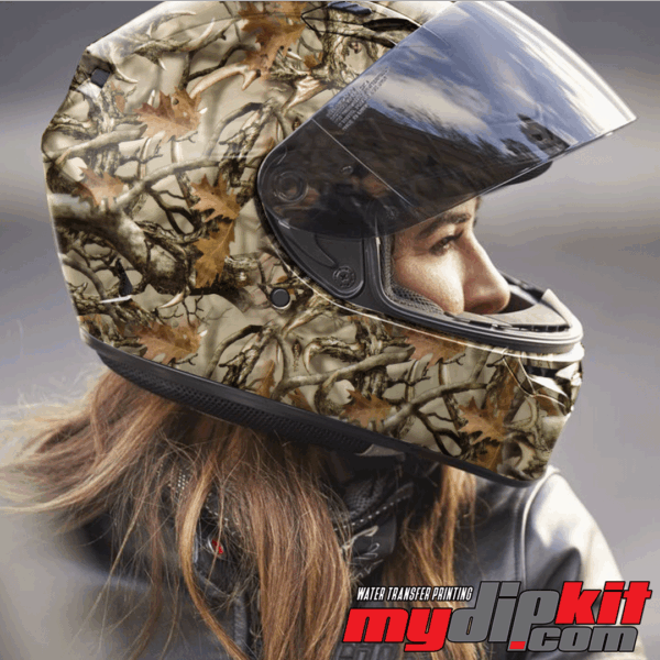 Blonde woman wearing a motorcycle helmet covered in Boneyard buck antler camo pattern through hydro dip.