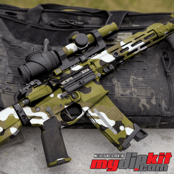 Firearm covered in "multi cam" green army camo pattern through hydro dip.