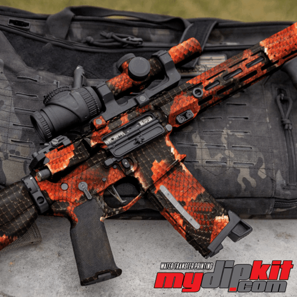 Firearm covered in red cobra skin pattern through hydro dip.