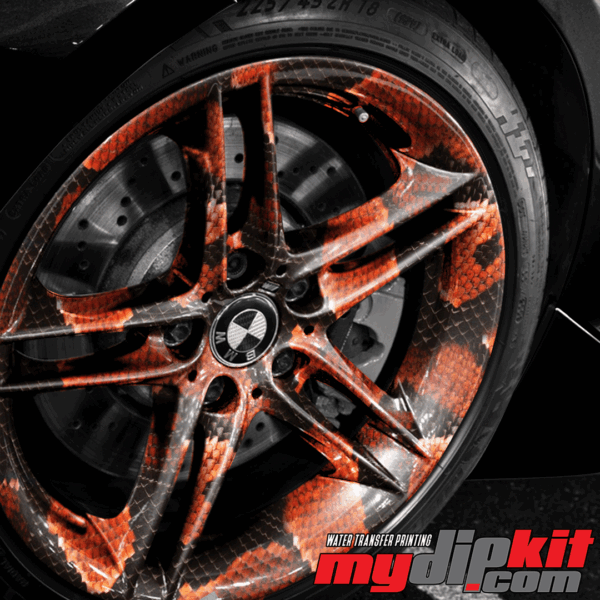 BMW Wheel covered in red cobra skin pattern through hydro dip